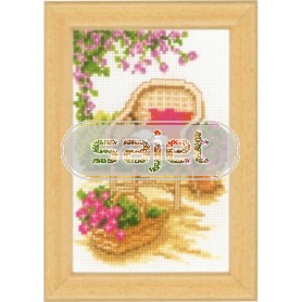 stickpackung rieten stoel in bloementuin