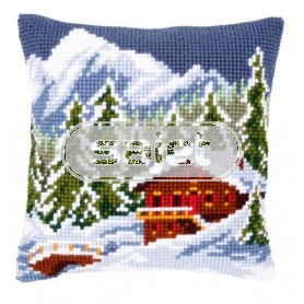 kreuzstichkissen chalet in winters gebergte