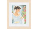 stickpackung dame bij rode bloemen